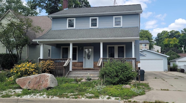 view of front of house with an outbuilding and a garage