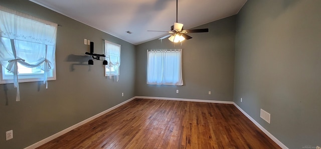 spare room featuring ceiling fan, hardwood / wood-style floors, and vaulted ceiling