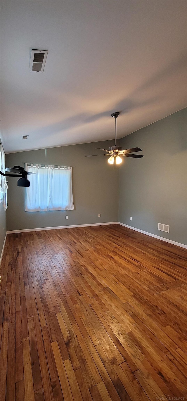 spare room with wood-type flooring and ceiling fan