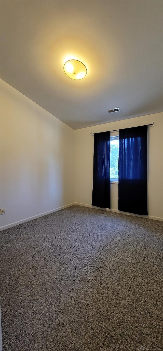 unfurnished room with carpet flooring