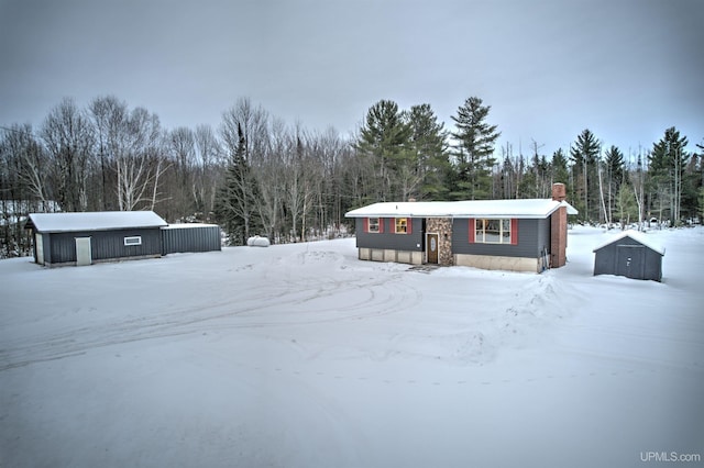 view of front facade with an outbuilding