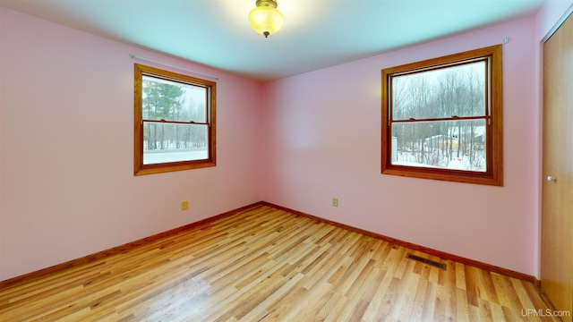 unfurnished room featuring light hardwood / wood-style flooring