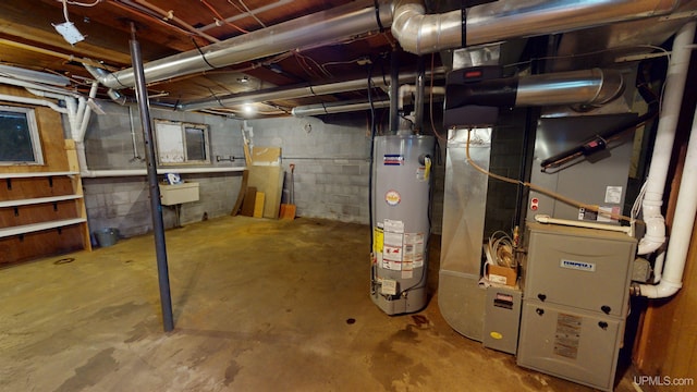 basement featuring heating unit, water heater, and sink