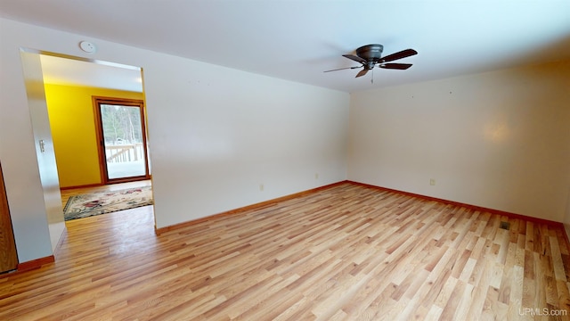 empty room featuring ceiling fan and light hardwood / wood-style floors