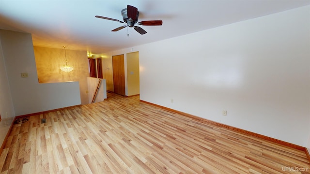 unfurnished room featuring light hardwood / wood-style flooring and ceiling fan