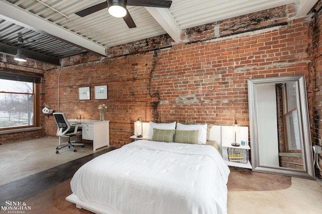 bedroom featuring beamed ceiling, ceiling fan, concrete flooring, and brick wall