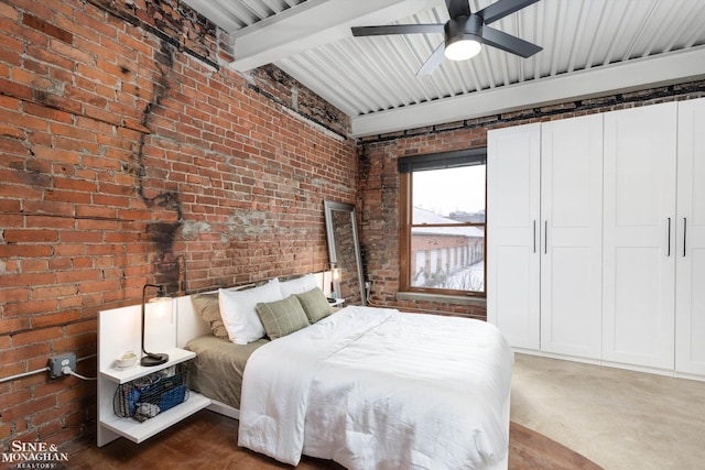 bedroom featuring beam ceiling, ceiling fan, concrete floors, and brick wall