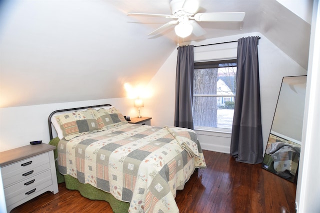 bedroom with lofted ceiling, ceiling fan, and dark wood-type flooring