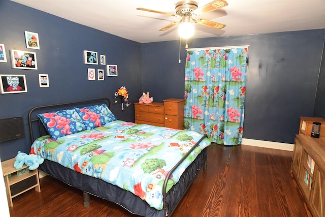 bedroom with ceiling fan and dark hardwood / wood-style floors