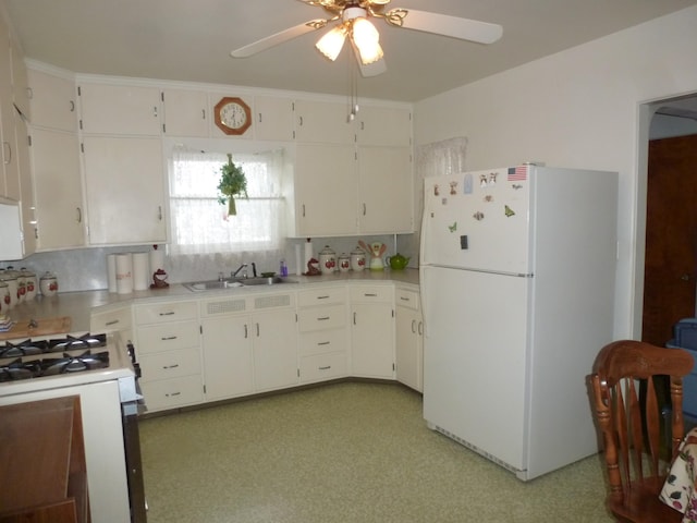 kitchen featuring white cabinetry, ceiling fan, and white appliances