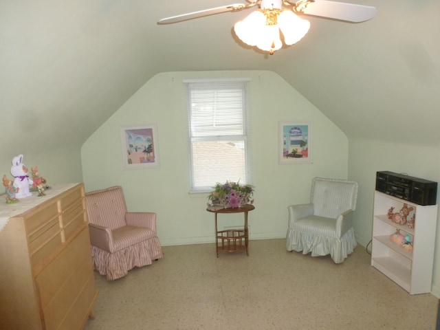 sitting room featuring ceiling fan and vaulted ceiling