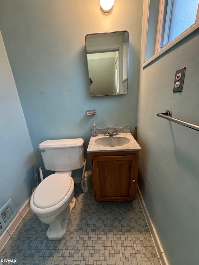 bathroom with vanity and toilet