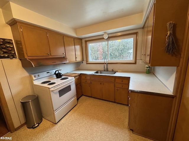 kitchen with white electric range oven and sink