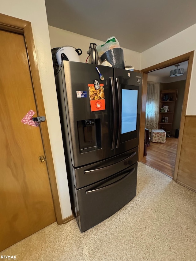 interior details featuring refrigerator with ice dispenser