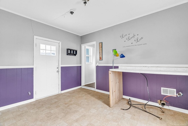 miscellaneous room featuring crown molding