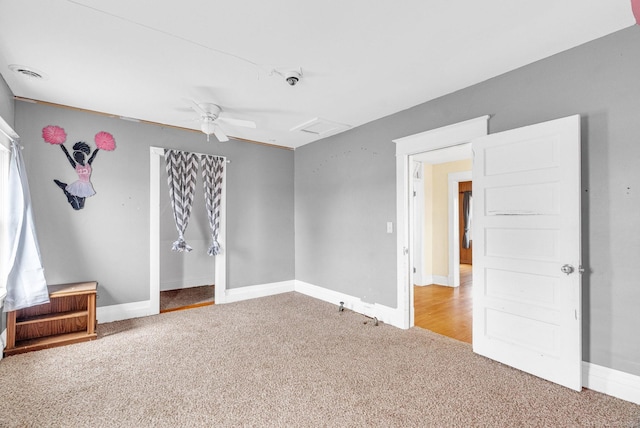 empty room with carpet floors and ceiling fan