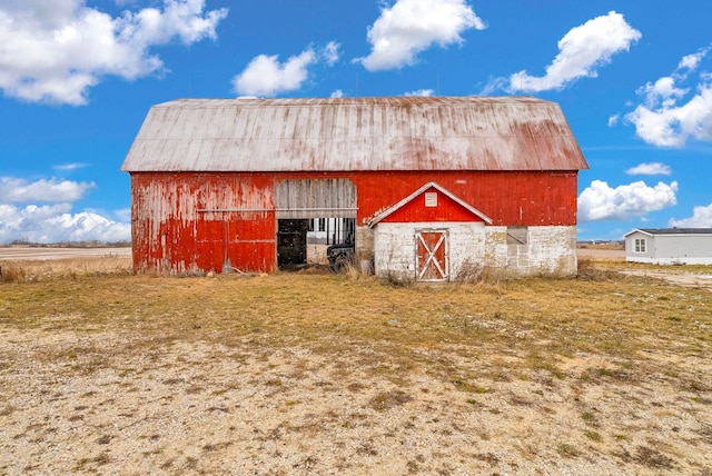 view of outdoor structure with a rural view