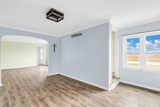 spare room featuring hardwood / wood-style floors