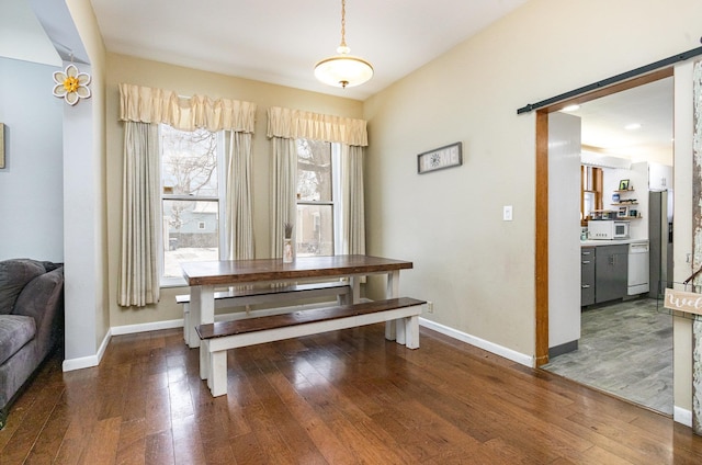 dining room with dark hardwood / wood-style floors