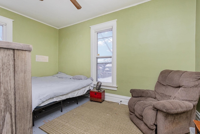 bedroom with ceiling fan and ornamental molding