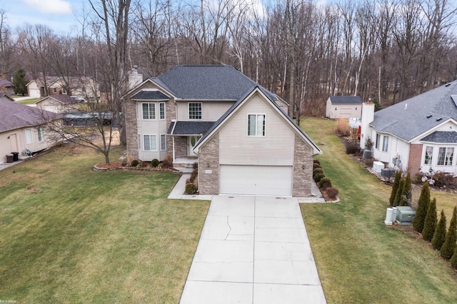 view of front facade with a front yard and a garage