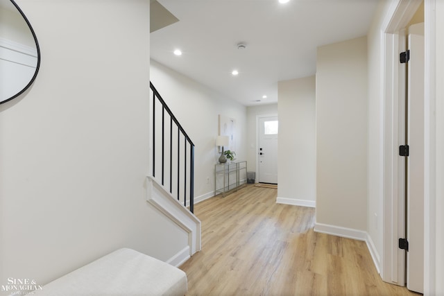 foyer with light hardwood / wood-style floors