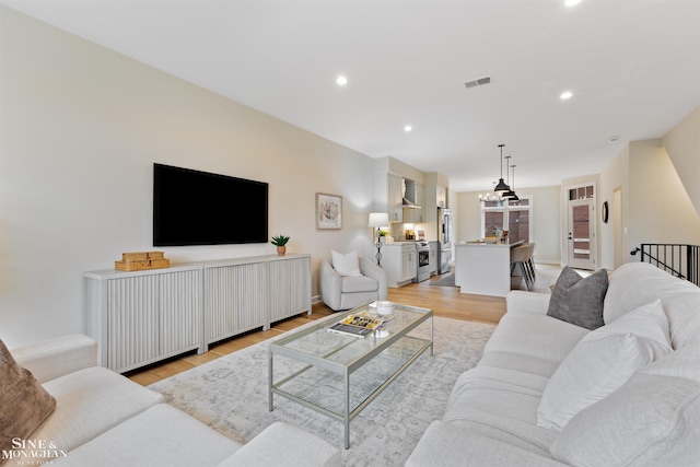 living room with light hardwood / wood-style flooring