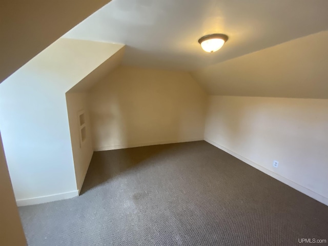 bonus room with carpet flooring and lofted ceiling