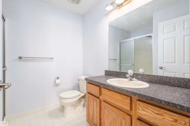 bathroom featuring a shower with door, vanity, and toilet