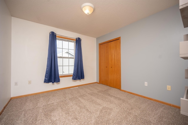 spare room featuring carpet flooring