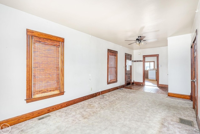 spare room featuring carpet flooring and ceiling fan