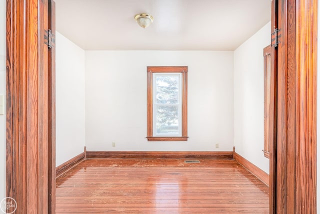 unfurnished room featuring light wood-type flooring