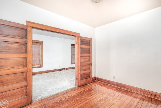 spare room with light hardwood / wood-style floors