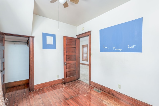 unfurnished bedroom with hardwood / wood-style floors and ceiling fan