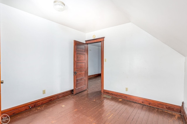 bonus room with wood-type flooring and vaulted ceiling