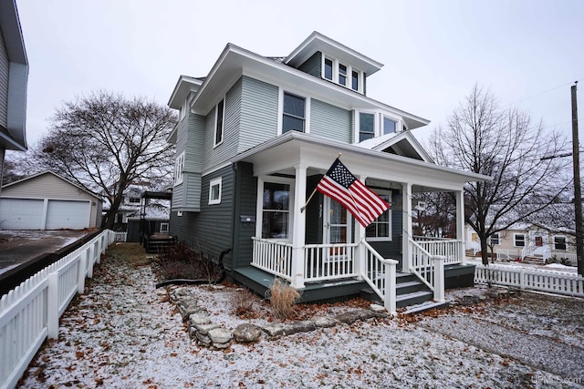 view of front of home featuring an outbuilding and a porch