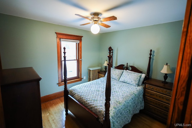 bedroom featuring hardwood / wood-style flooring and ceiling fan