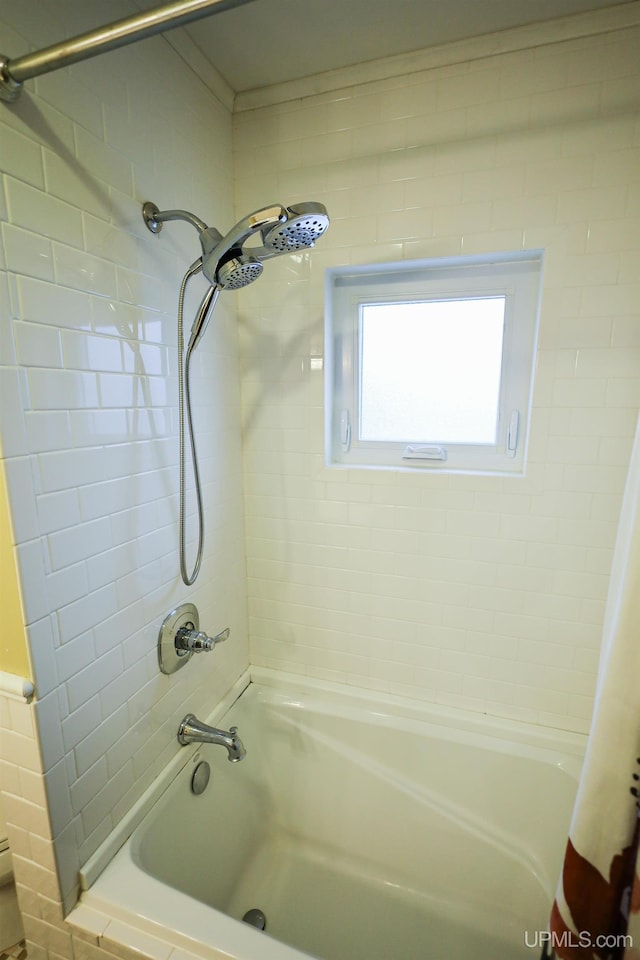 bathroom featuring shower / bath combo with shower curtain