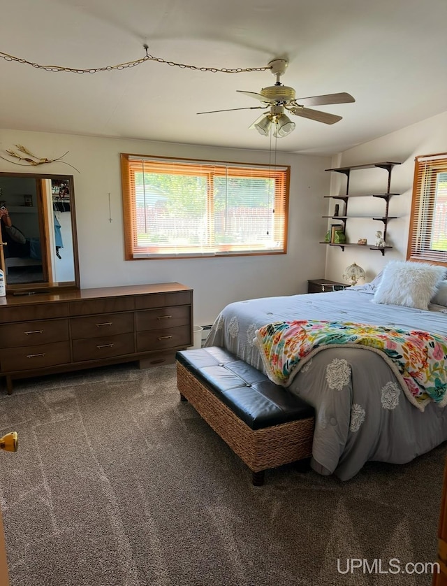 carpeted bedroom with ceiling fan