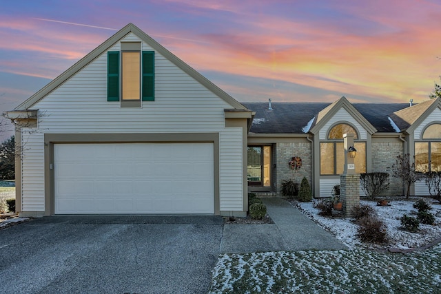 view of front of home with a garage