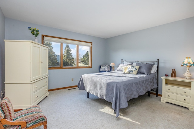 bedroom with light colored carpet