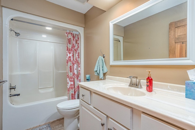 full bathroom featuring vanity, hardwood / wood-style flooring, shower / bathtub combination with curtain, and toilet