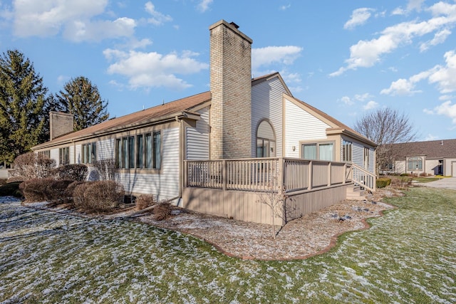 view of side of home featuring a lawn