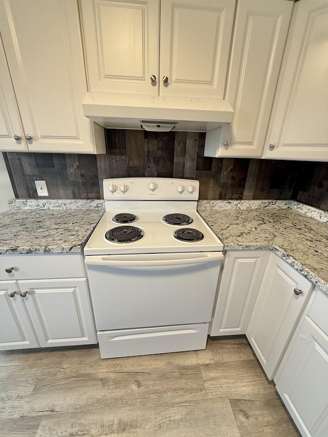 kitchen with white cabinetry, electric range, light stone countertops, and light wood-type flooring