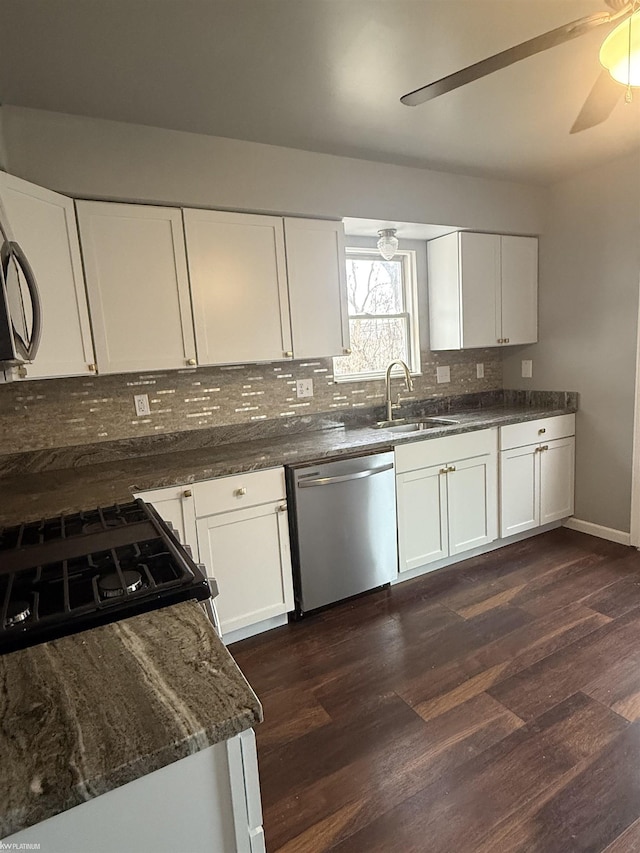 kitchen featuring white cabinets, ceiling fan, dark wood-type flooring, sink, and dishwasher