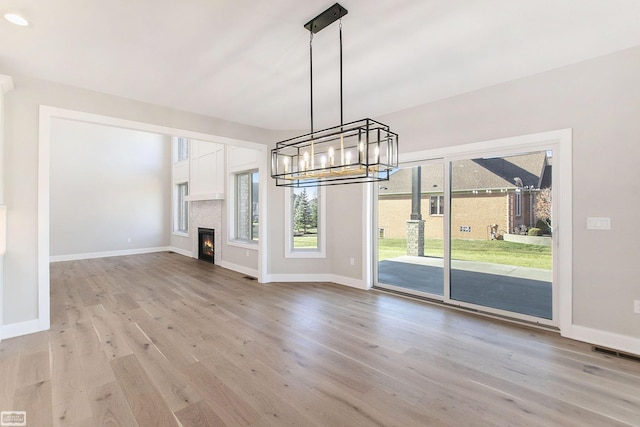 unfurnished living room with light hardwood / wood-style flooring