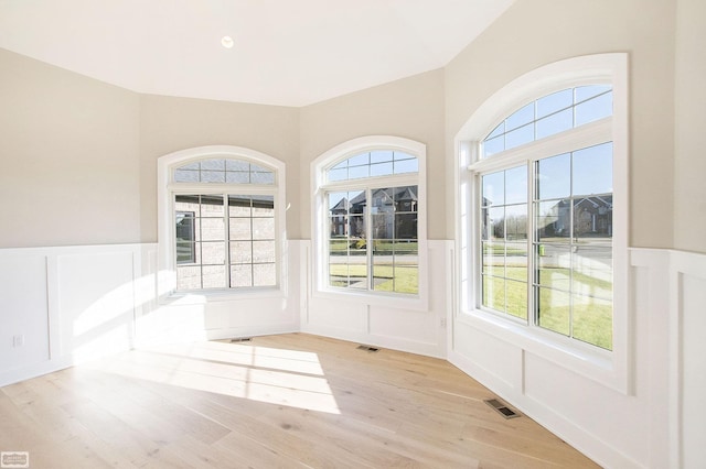 interior space with a healthy amount of sunlight and light hardwood / wood-style flooring