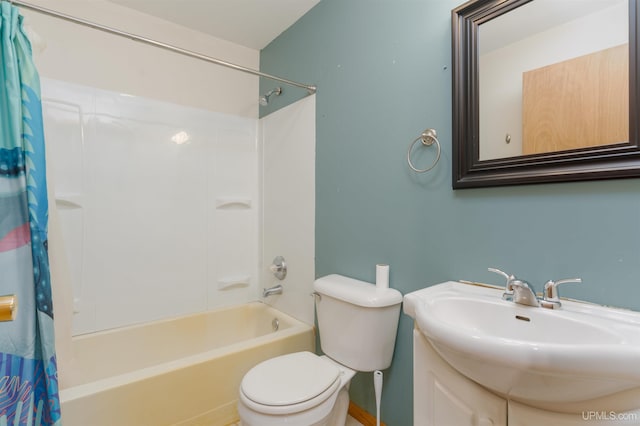 full bathroom featuring vanity, shower / tub combo, and toilet