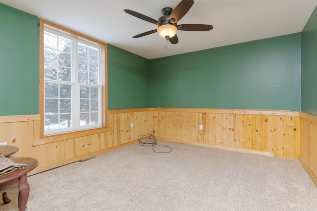 carpeted empty room with ceiling fan