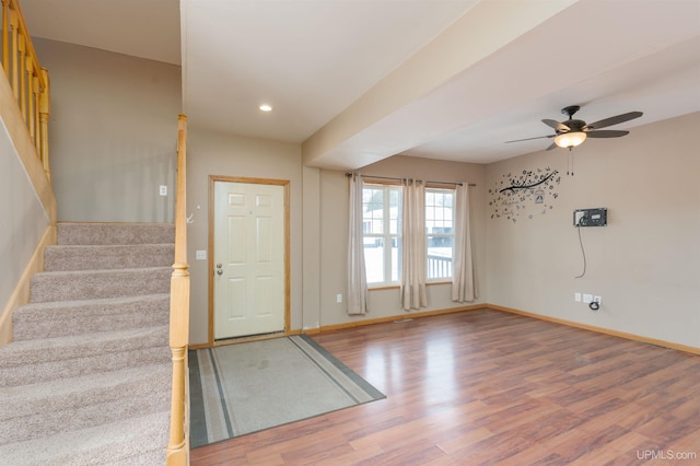 entrance foyer featuring ceiling fan and wood-type flooring